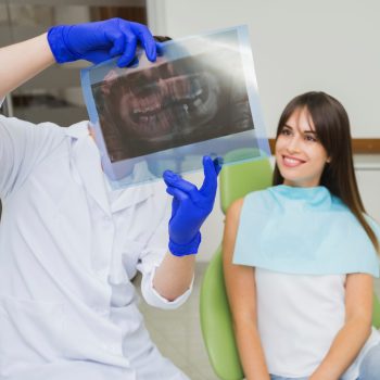 dentist-woman-looking-radiography dentist-woman-looking-radiography