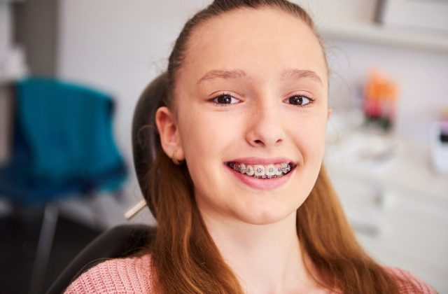 portrait-smiling-child-with-braces-dentist-s-office portrait-smiling-child-with-braces-dentist-s-office